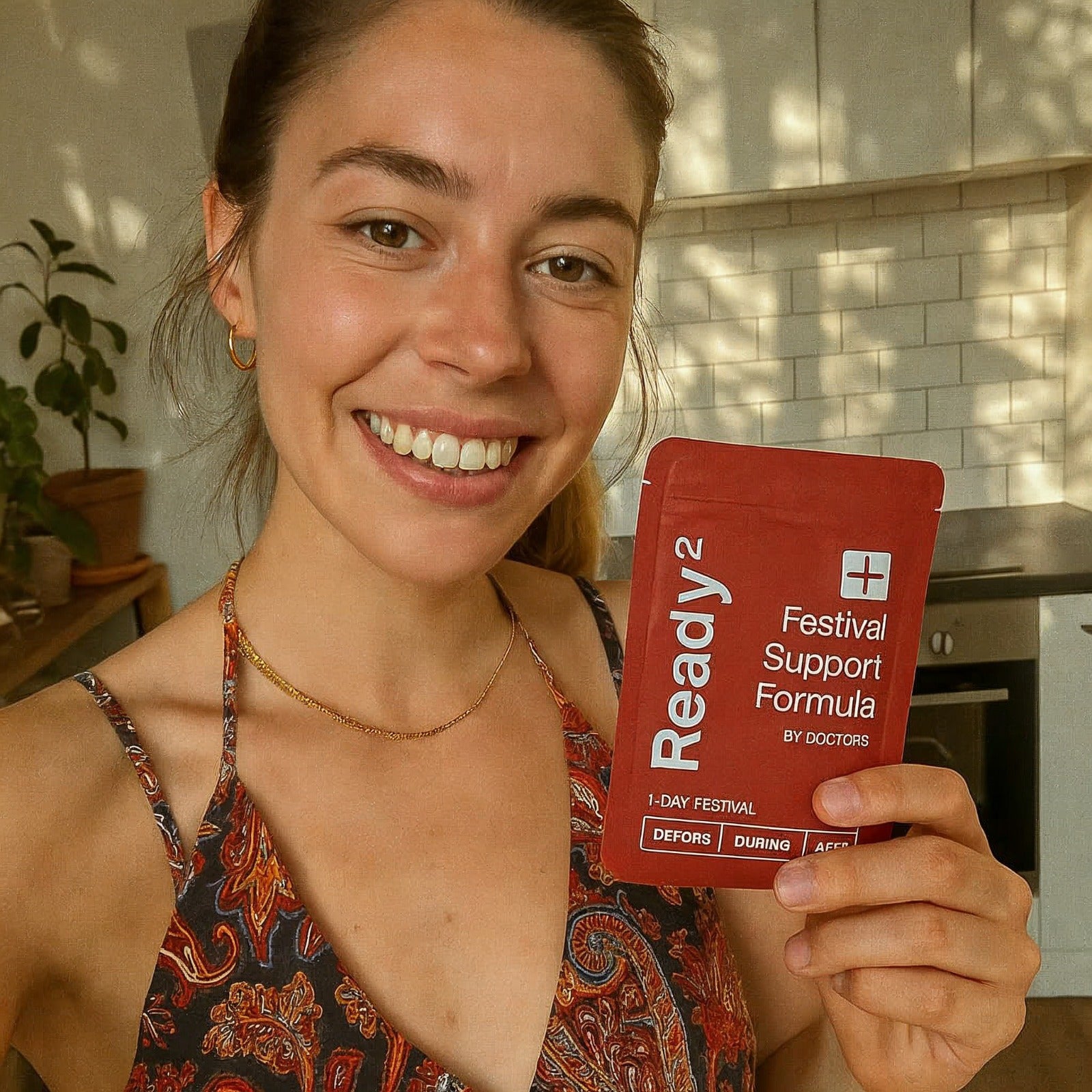 a woman holding our Ready2 pouch for a review