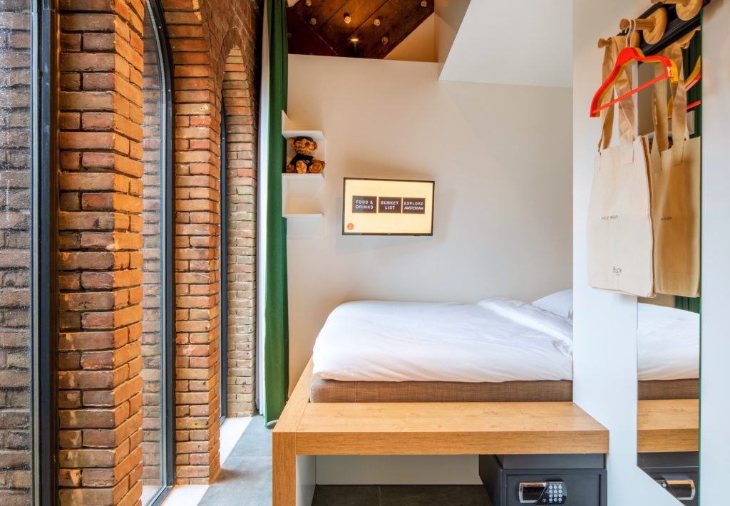 Bunk Amsterdam room with original church brickwork